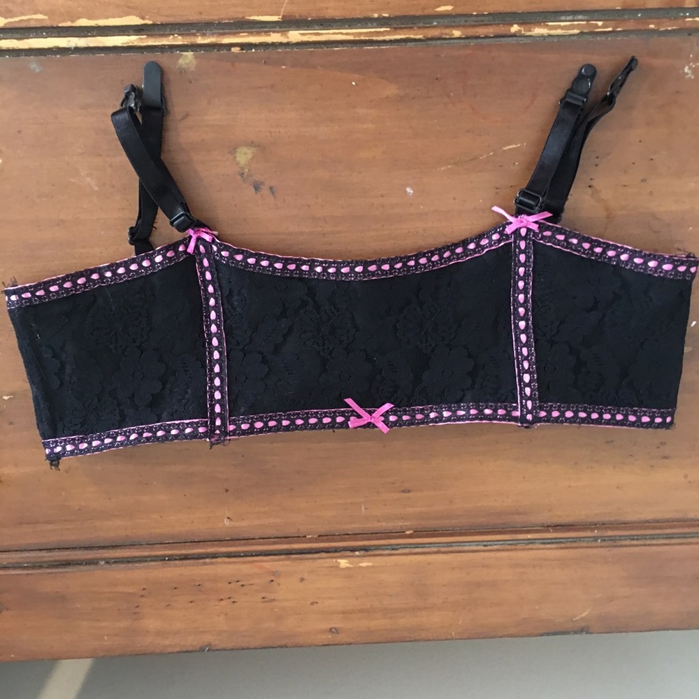 Black and hot pink garter belt.